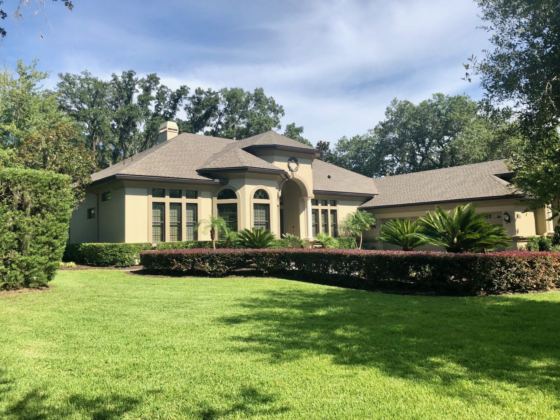 Professional architectural shingle roof replacement on a luxury Jacksonville home, completed by expert roofing contractor The Dantzler Group.